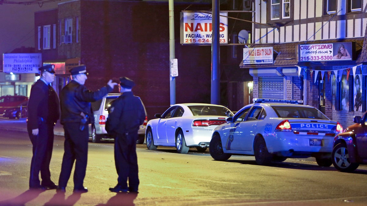  Investigators gather at the crime scene in the Mayfair section of Philadelphia, Monday Dec. 15, 2014, after an officer fired their weapons at a man. (AP File Photo/ Joseph Kaczmarek) 