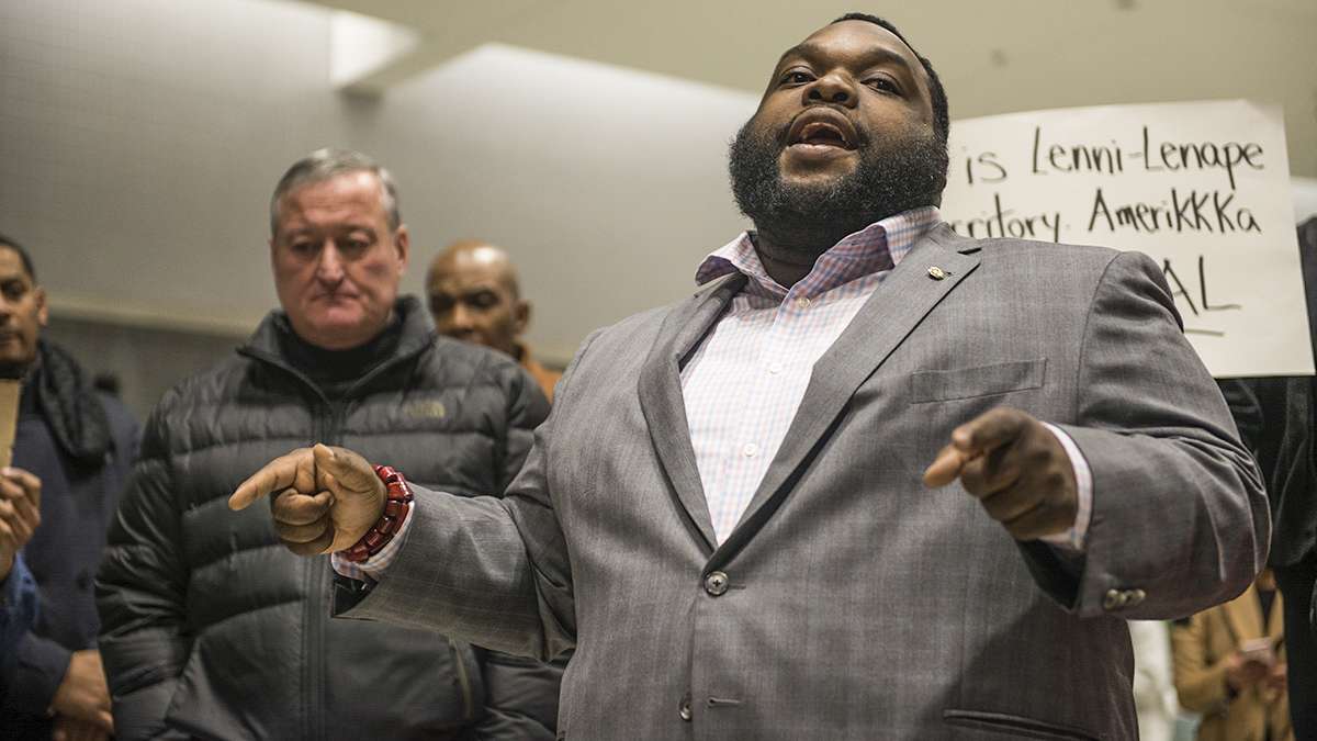 State Rep. Jordan Harris speaks to protesters and media about the developing situation regarding President Donald Trump’s executive order on immigration at the Philadelphia International Airport. (Branden Eastwood for NewsWorks)