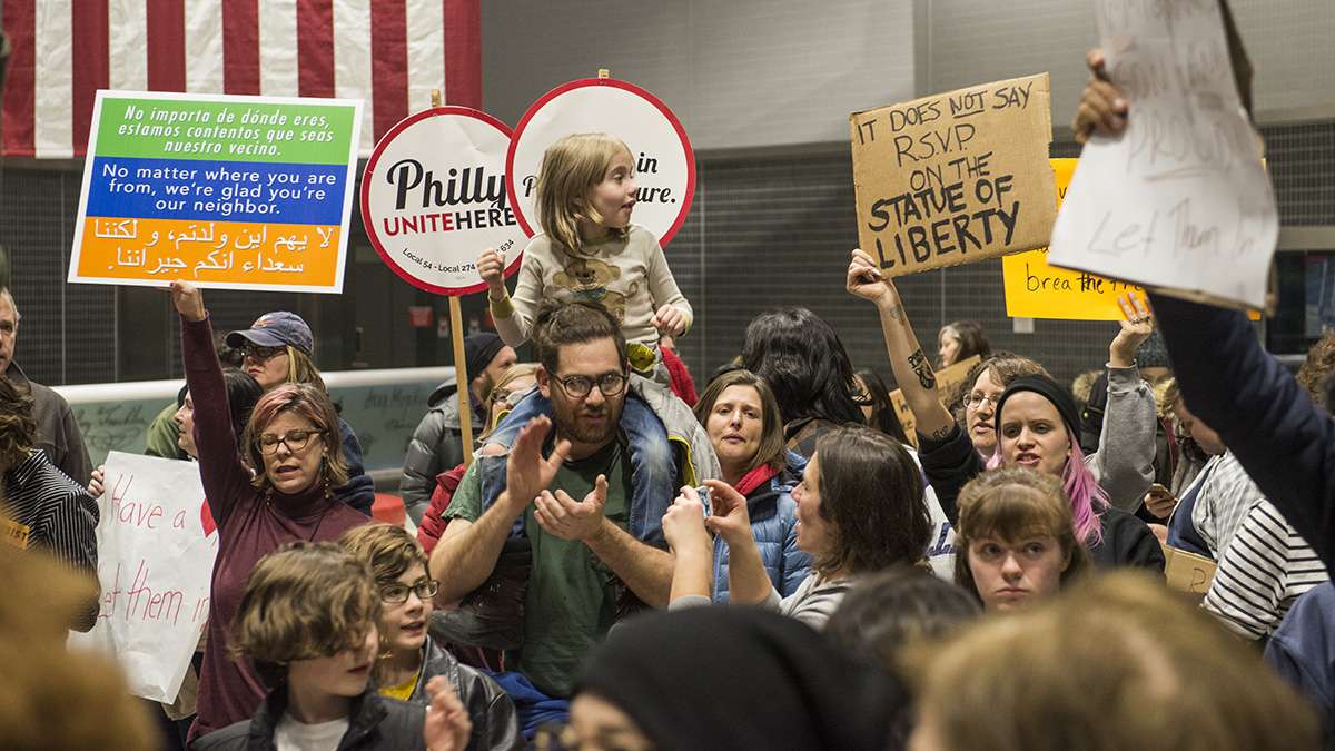 Protesters angered by President Donald Trump’s executive order that prevented refugees, visa and green card holders from entering the US chant pro-immigration slogans at Philadelphia International Airport. (Branden Eastwood for NewsWorks)