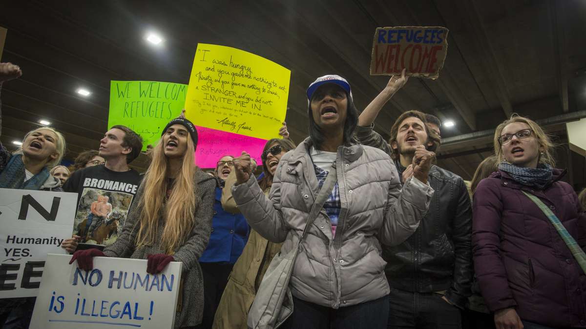 Protesters opposed to Donald Trump’s executive order on immigration march outside of Terminal A at Philadelphia International Airport. (Branden Eastwood for NewsWorks)