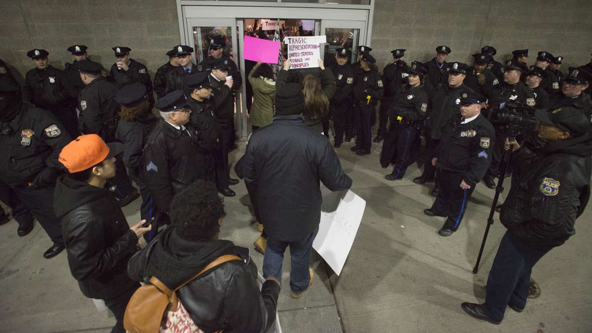 Police were eventually told to allow a group of protesters outside of the terminal entrance to join a group that had already entered. (Branden Eastwood for NewsWorks)