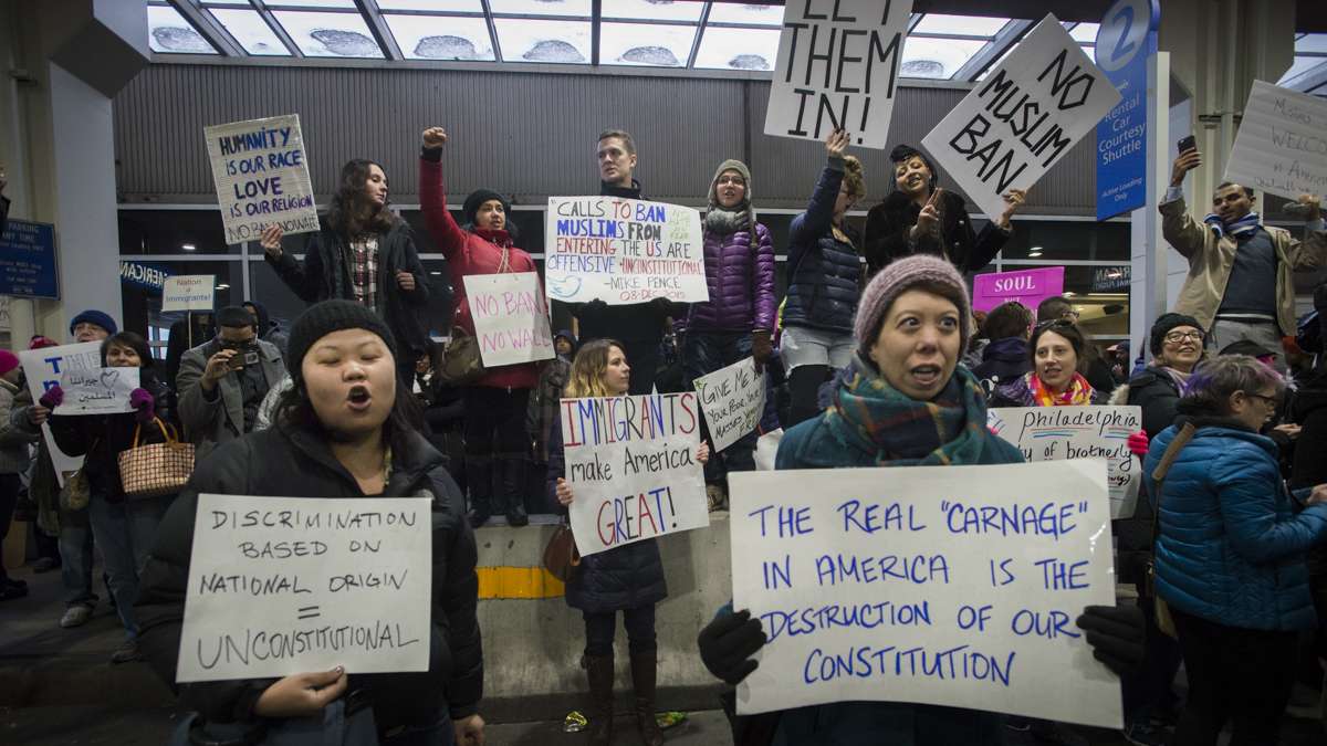 Protesters opposed to Donald Trump’s executive order on immigration march outside of Terminal A at Philadelphia International Airport. (Branden Eastwood for NewsWorks)