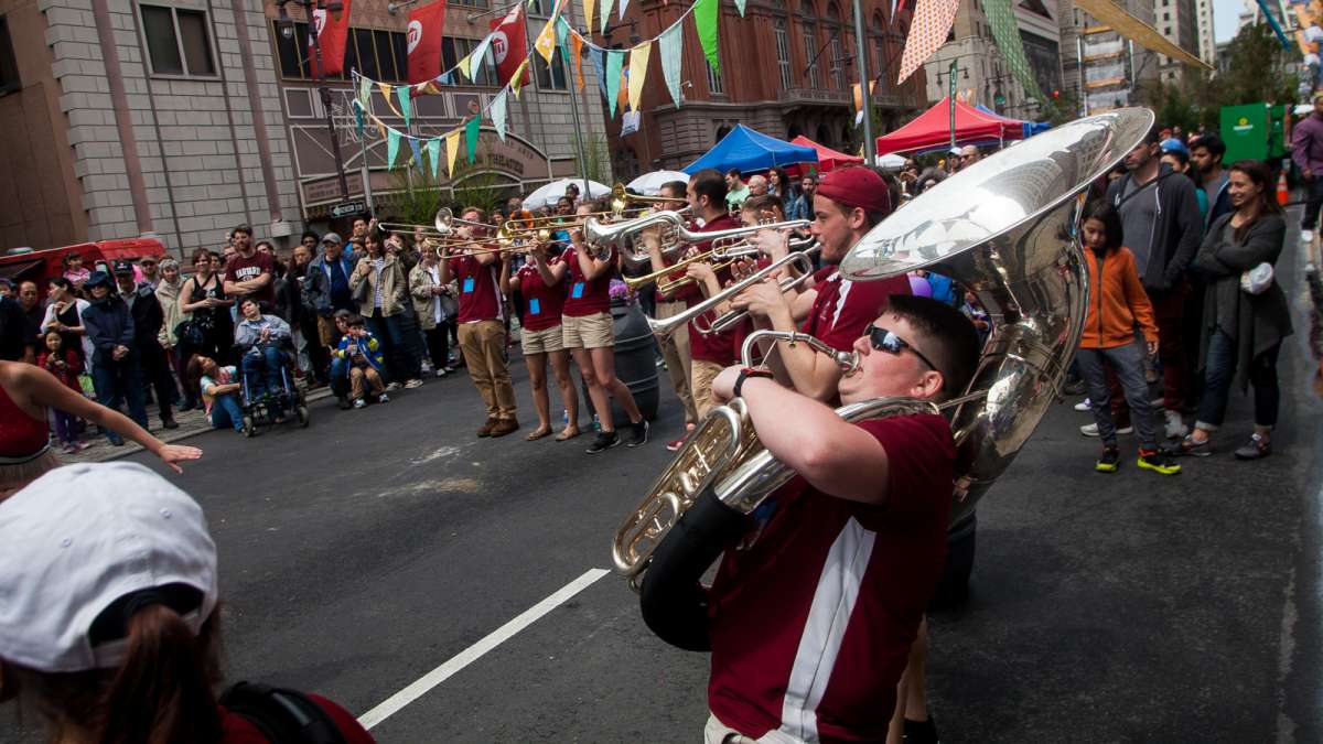 Members of Temple University's Cherry and White Band perform on Broad Street at the PIFA Street Fair.