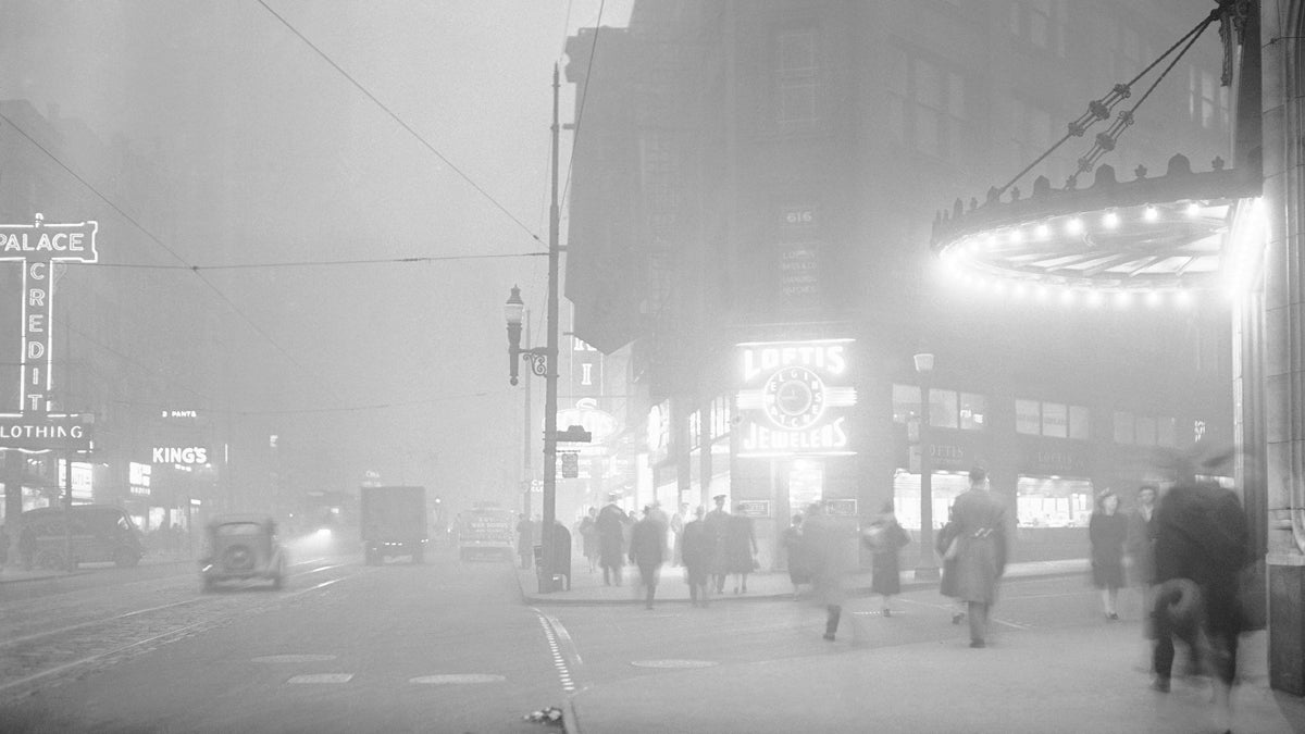  In this archival photograph from 1944, the clock at right center shows a quarter to noon, but in downtown Pittsburgh, Pa., residents walked in artificially lighted streets when one of the heaviest smogs in the city's history blanketed the town. Today, only two Pa. cities have air quality that is average or above average compared to other U.S. cities.(AP File Photo/Walter Stein) 
