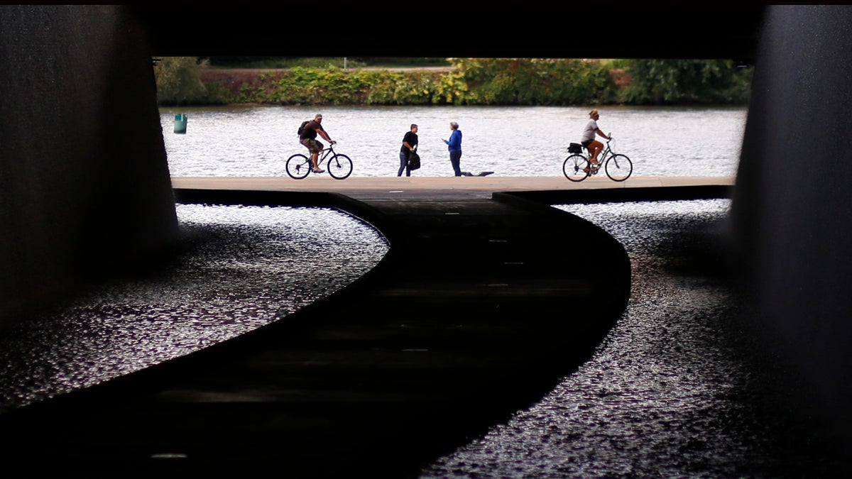  Cyclists ride along the Allegheny River in this view of a path in a tunnel under the David Lawrence Convention Center in downtown Pittsburgh. (AP Photo/Gene J. Puskar) 