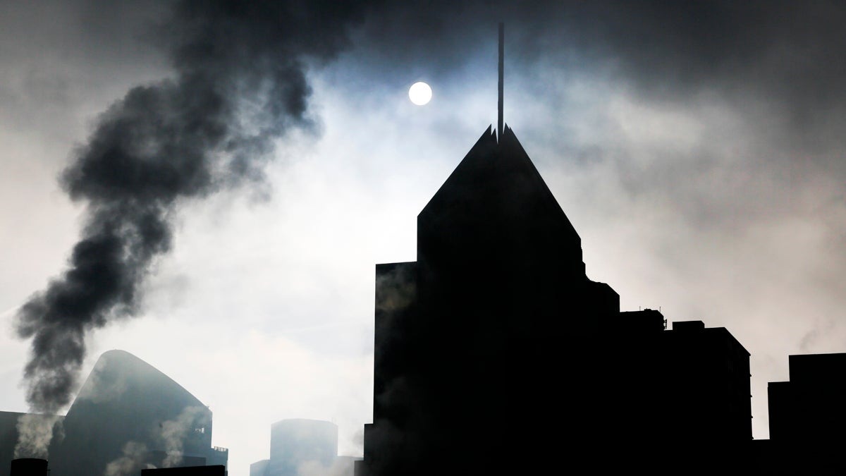  The skyline of downtown Pittsburgh is silhouetted by the rising sun on a foggy morning, December 2015. (AP Photo/Gene J. Puskar) 