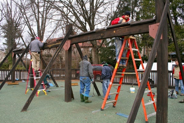 <p><p>Volunteers work replacing bolts and chains on Henry H. Houston playground's swing set. (Lane Blackmer/for NewsWorks)</p></p>
