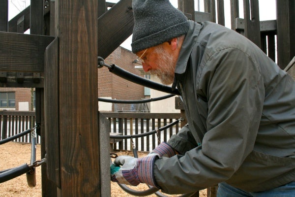 <p><p>Bob Rossman replaces a chain at Henry Houston's playground during the city's Martin Luther King Day of Service. (Lane Blackmer/for NewsWorks)</p></p>
