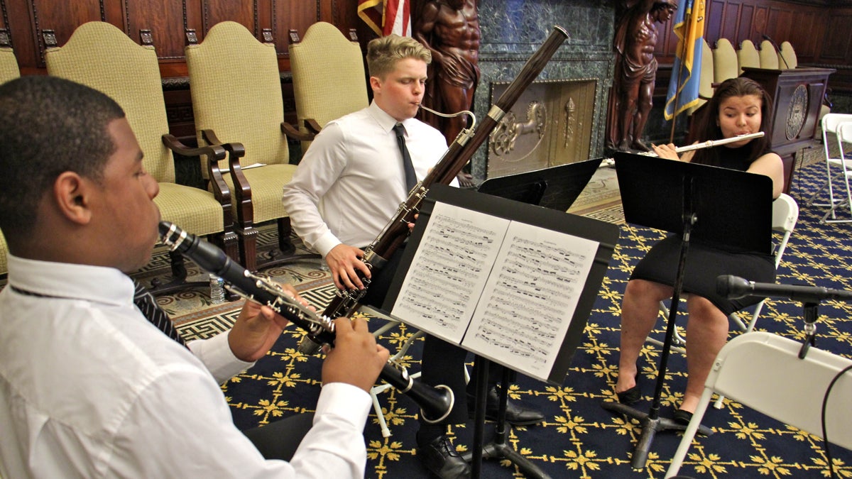  Philadelphia Music Alliance for Youth (PMAY) students (from left) Marquise Bradley, David Heister, and Malinda Voell, perform in the Mayor's Reception Room. (Emma Lee/WHYY) 