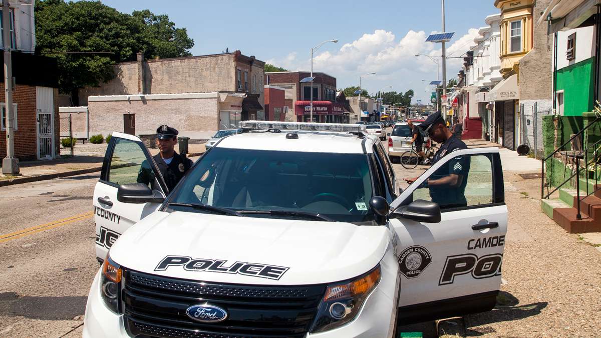  Camden police officers make a stop. (Brad Larrison/ NewsWorks file photo) 