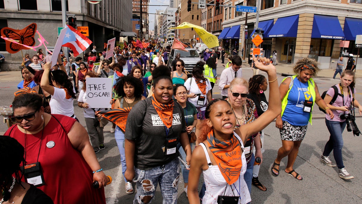 Marchers from 40 progressive groups from 30 states take part in the “Still We Rise” March in downtown Pittsburgh Friday
