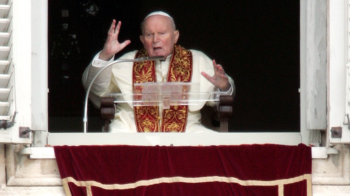  Pope John Paul II gives his Easter Sunday blessing from his studio window overlooking St. Peter's Square at the Vatican, Sunday, March 27, 2005, shortly before his death. (AP Photo/Pier Paolo Cito, file) 