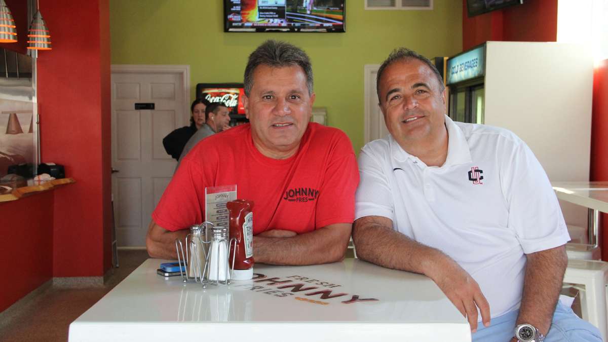 Tom Faragalli (right) and John Spadavecchia own Johnny Fries in Ortley Beach. They were able to reopen in March after repairing heavy damage from Hurricane Sandy. (Emma Lee/for NewsWorks)