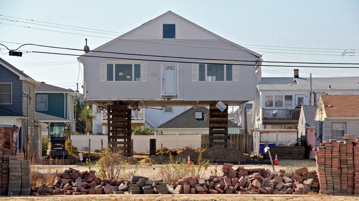  An Ortley Beach bungalow is raised to comply with new building codes. Others will have to follow suit or pay prohibitive flood insurance premiums. (Emma Lee/WHYY) 