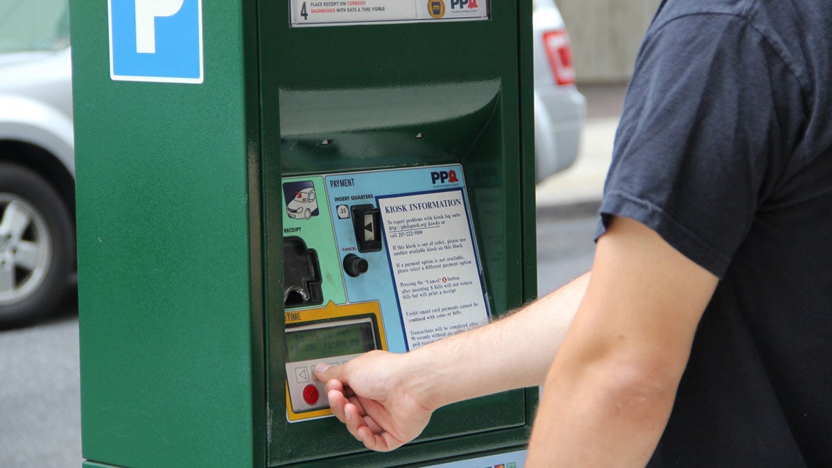  A driver uses one of the Philadelphia Parking Authority kiosks. The PPA suspended its smartphone app, MeterUp, on Wednesday, April 12, 2017. (Emma Lee/WHYY, file) 