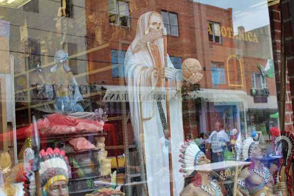The Philadelphia Botanica has been on 5th Street for about 45 years and labels itself as a “place for spiritual arts.”  It sells everything ranging from potions, herbs and candles to statuettes depicting Catholic saints, African and Caribbean Orishas. (Elisabeth Perez-Luna)