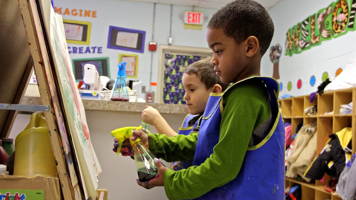  Terrell Patterson and Dominic Sampaio paint together using spray bottles at Paley Early Learning Center in Northeast Philadelphia. March 18, 2015 (Emma Lee/WHYY, file) 