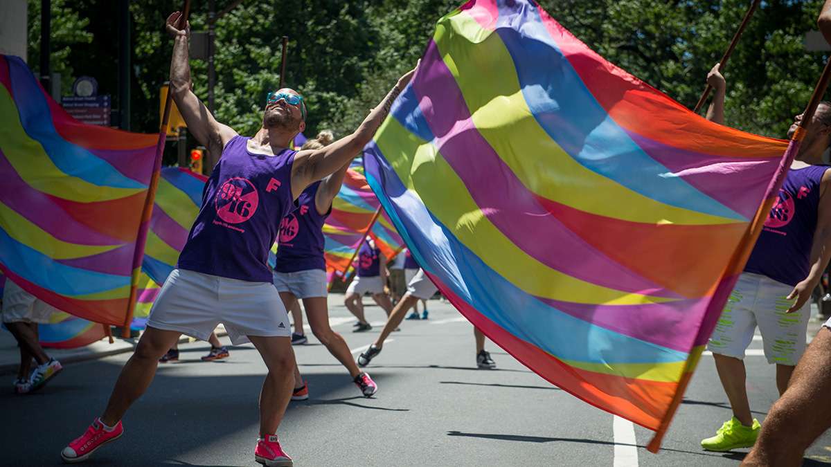 Members of the performance group 'Flaggots' dance at the Philadelphia Pride Parade and Festival. (Branden Eastwood for WHYY)