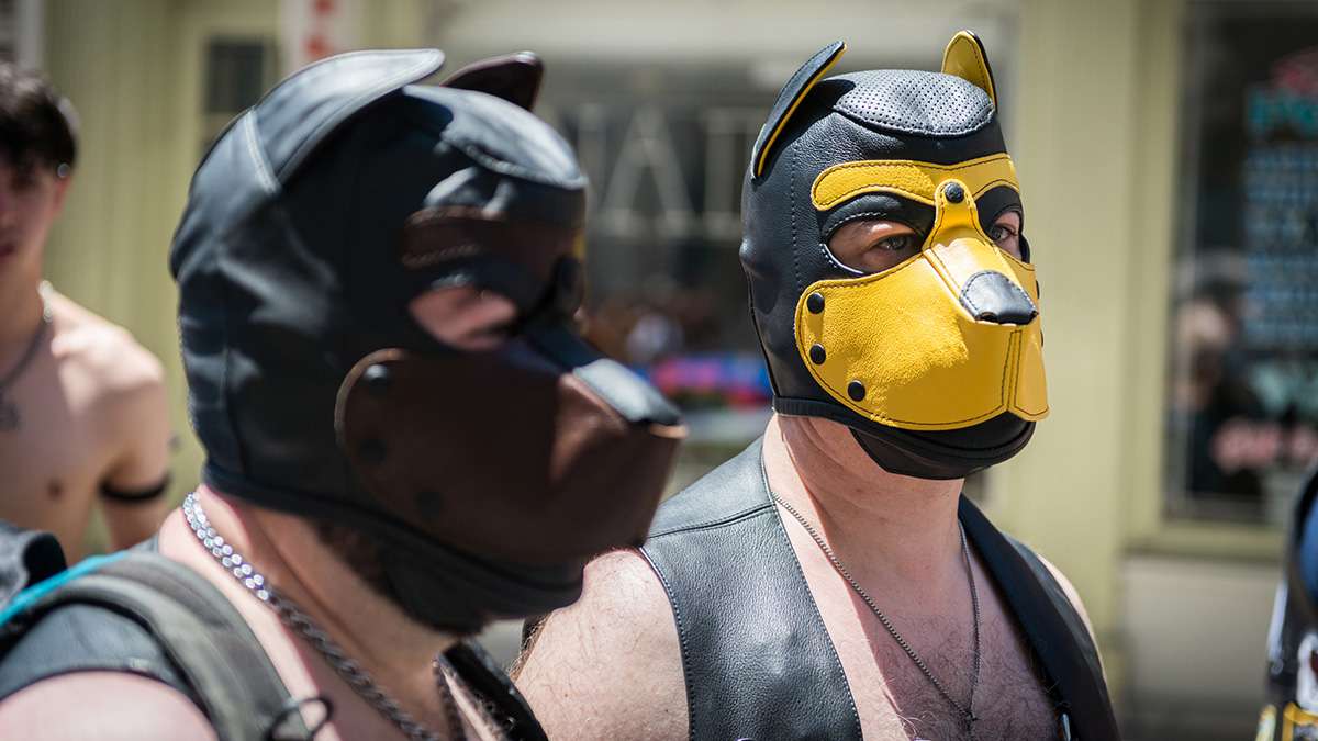 Men in leather dog masks participate in the Philadelphia Pride Parade and Festival. (Branden Eastwood for NewsWorks)