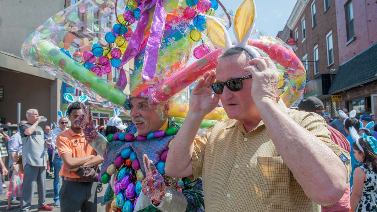 Parade veteran Henri David (center) poses for photos, while Philadelphia Mayor Jim Kenny adjusts his rabbit ears.