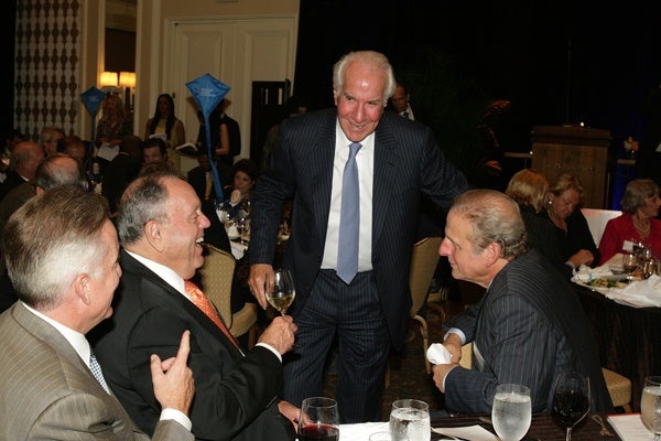 <p><p>Honorary event chair and chair of Comcast-Spectacor Ed Snider (standing), talks with guests including Fred Shabel, vice chair of Comcast-Spectacor (left), and Ron Caplan of Philadelphia Management Corp. (Photo courtesy of Deborah Boardman)</p></p>
