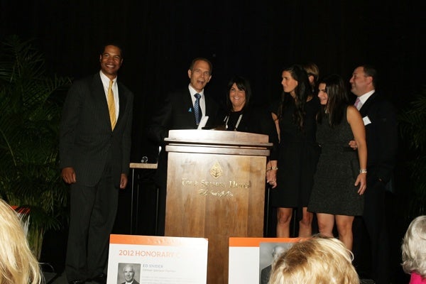 <p><p>Event emcee Joe Watkins (left) and founding event cochair Neal Rodin of International Financial Co., with the family of the late Warren Weiner during a tribute to Weiner (Photo courtesy of Deborah Boardman)</p></p>
