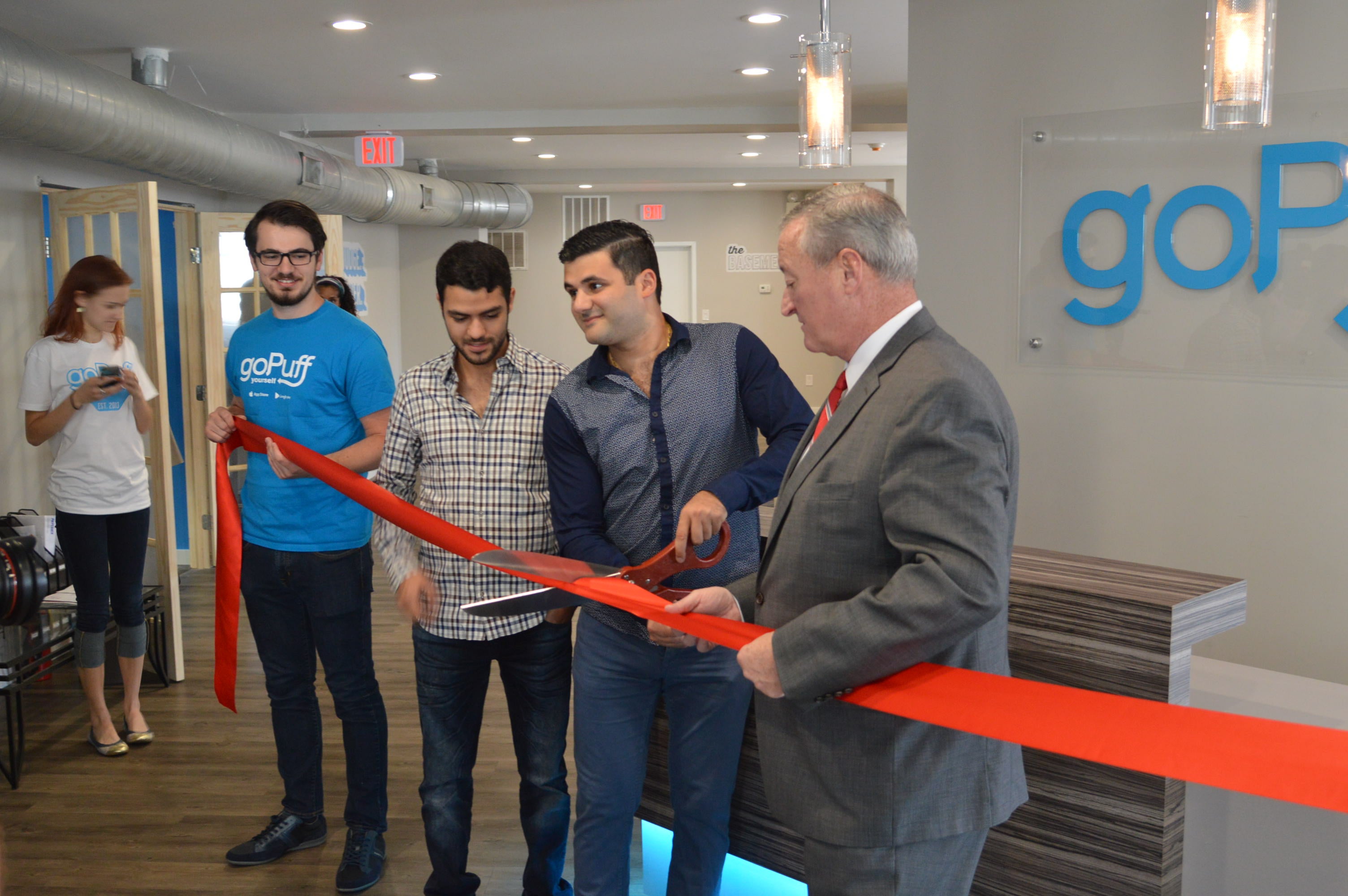  Mayor Jim Kenney helps with ribbon cutting at Go Puff Headquarters (Tom MacDonald/WHYY) 