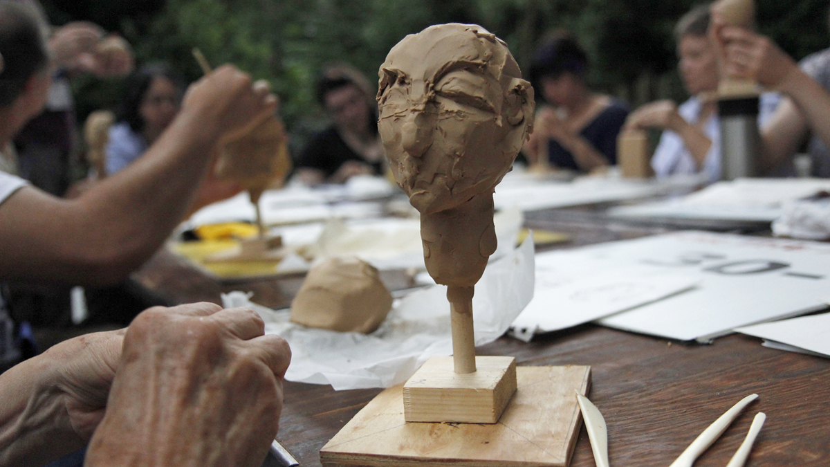  Veteran puppet-maker Deborah Costine sculpts the head of a character she designed earlier this week.  (Amy DiPierro/For Newsworks) 