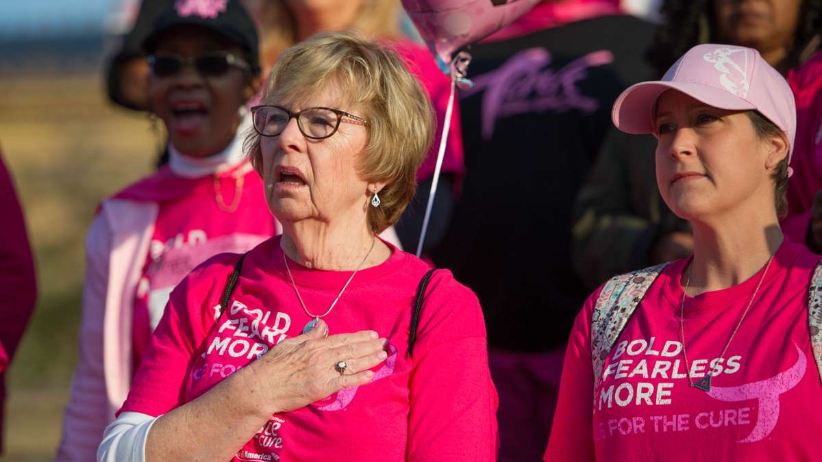 Mother and daughter Maureen and Rebecca Beall during the national anthem. Maureen Beall is a 10 year cancer survivor. Rebecca is a 1 year survivor.