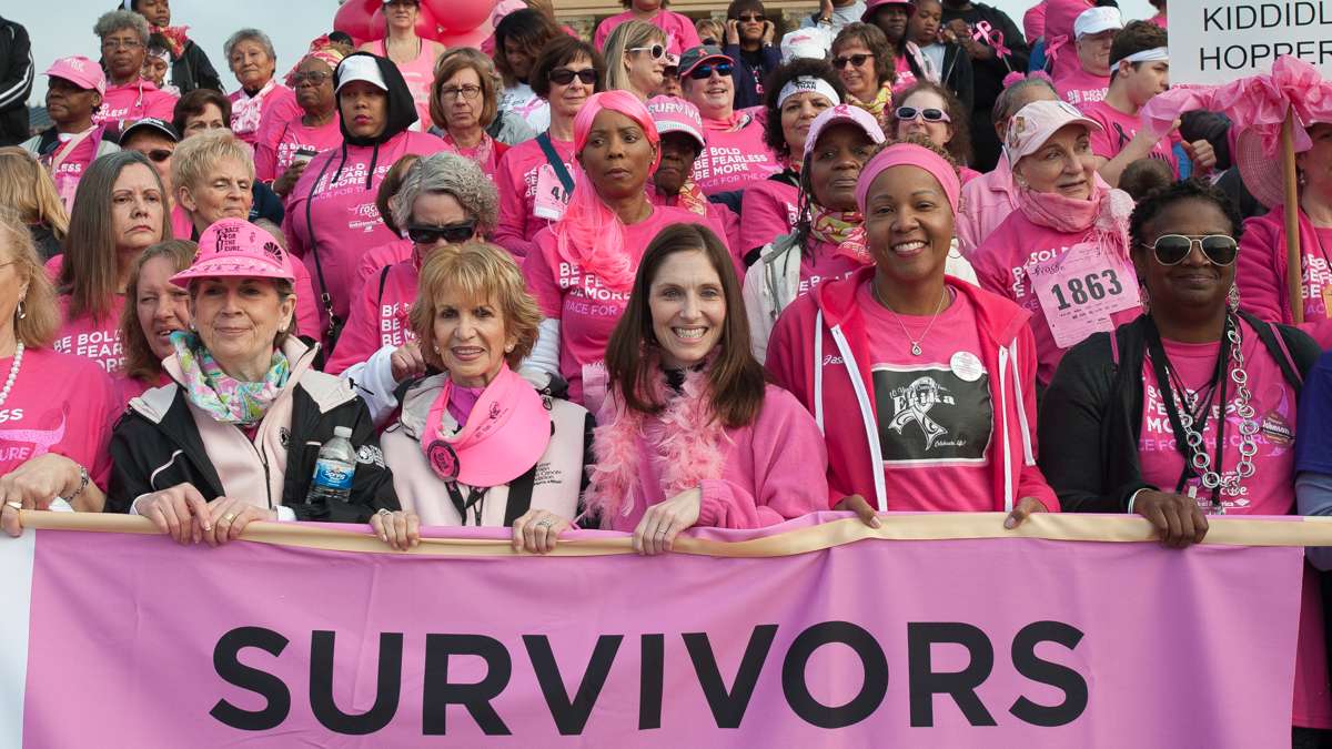 Breast cancer survivors stand at the top of the steps of the Philadelphia Museum of Art.