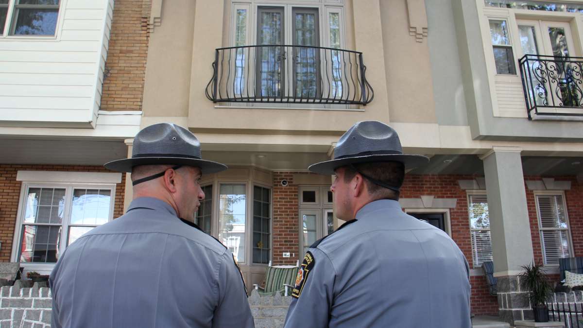 State troopers stand guard outside the home of union head John Dougherty in South Philadelphia. (Emma Lee/WHYY)