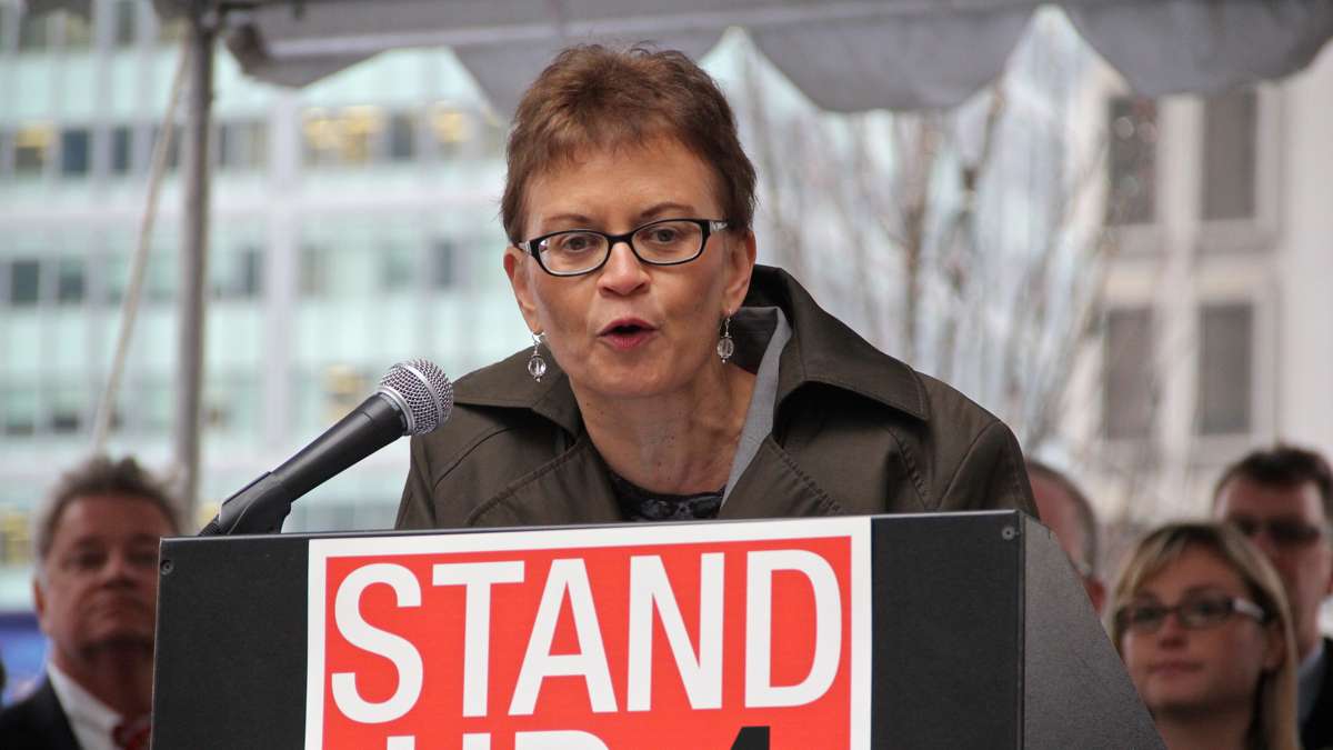 Acting Federal Transit Administration Administrator Therese McMillan speaks at a rally on Dilworth Plaza urging federal funding for transportation infrastructure improvements. (Emma Lee/WHYY)