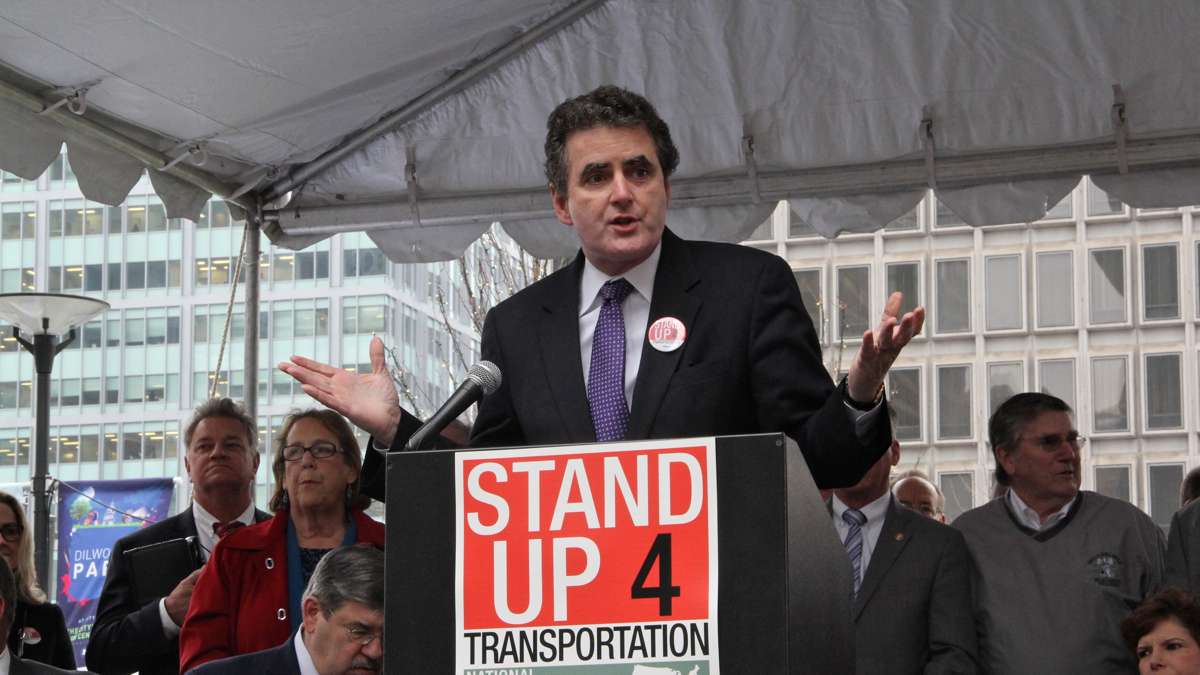 U.S. Rep. Michael G. Fitzpatrick speaks at a rally on Dilworth Plaza urging federal funding for transportation infrastructure improvements. (Emma Lee/WHYY)