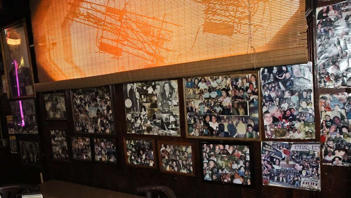 Customer photos from over 75 years are displayed on the walls of Ray's Happy Birthday Bar in South Philly. (Kimberly Paynter/WHYY)