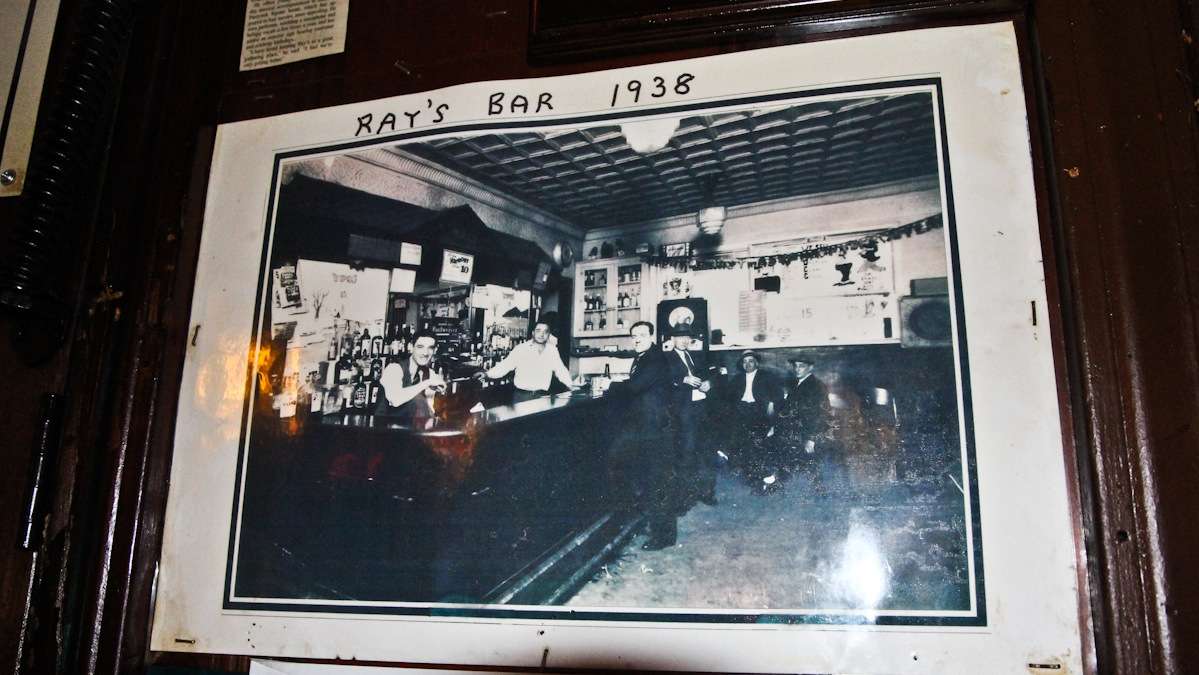 Founder Ray, (left, behind the bar) at Ray's the year the bar opened. (Kimberly Paynter/WHYY)