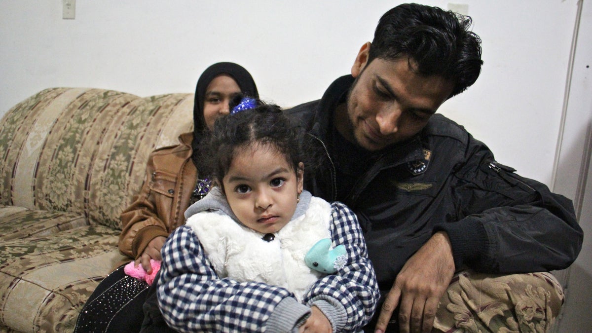  Refugees Mohammad Hasan, his daughter, Noor, 3, and wife, Noor, arrived in Philadelphia on Jan. 31, with the help of Nationalities Service Center. Since then, Donald Trump's immigration policies have slowed the flow of refugees and resettlement agencies have had to cut back. (Emma Lee/WHYY, file) 
