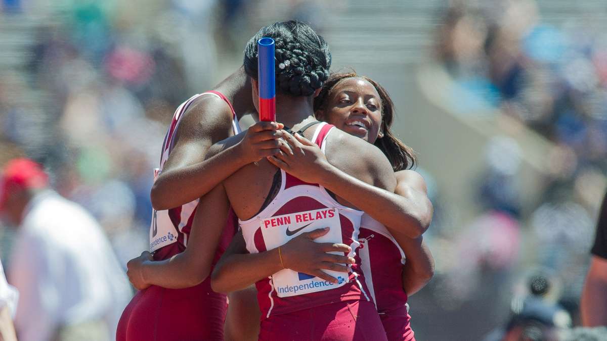 Edwin Allen's team celebrates after winning the the high school girls' 4-by-100 Championship of America. The team from Clarendon, Jamaica, won the race with a Penn Relays record time of 43.96 seconds.