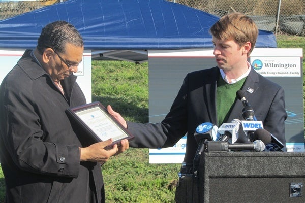 <p><p>DNREC Secretary Collin O'Mara presents Mayor Baker with a plaque recognizing his administration's efforts to improve the environment in the city of Wilmington. (Mark Eichmann/WHYY) </p></p>
