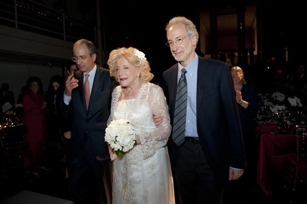 <p><p>Suzanne Roberts is escorted "down the aisle" by her two sons, Brian (left) and Rob Roberts (Photo courtesy of Susan Beard Design)</p></p>
