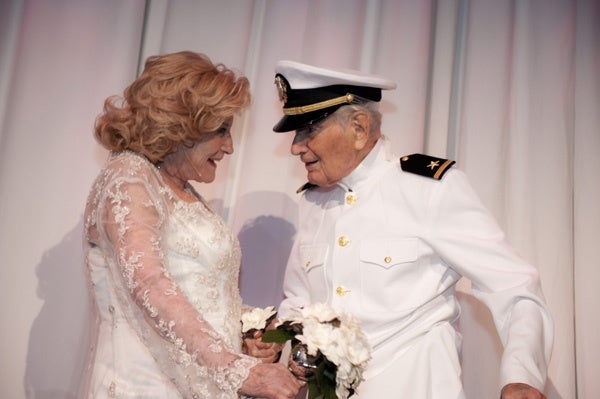 <p><p>Suzanne and Ralph Roberts reenact their wedding photo. Suzanne's dress for the 70th anniversary celebration is from David's Bridal (Photo courtesy of Susan Beard Design)</p></p>
