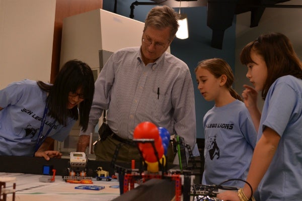 <p><p>SCH teacher Peter Randall works with the middle school girls' robotics team. (Zachary Shevich/for NewsWorks)</p></p>
