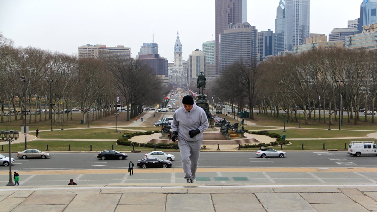 Rocky impersonator John Monforto runs up the steps of the Philadelphia Museum of Art. (Emma Lee/for NewsWorks)
