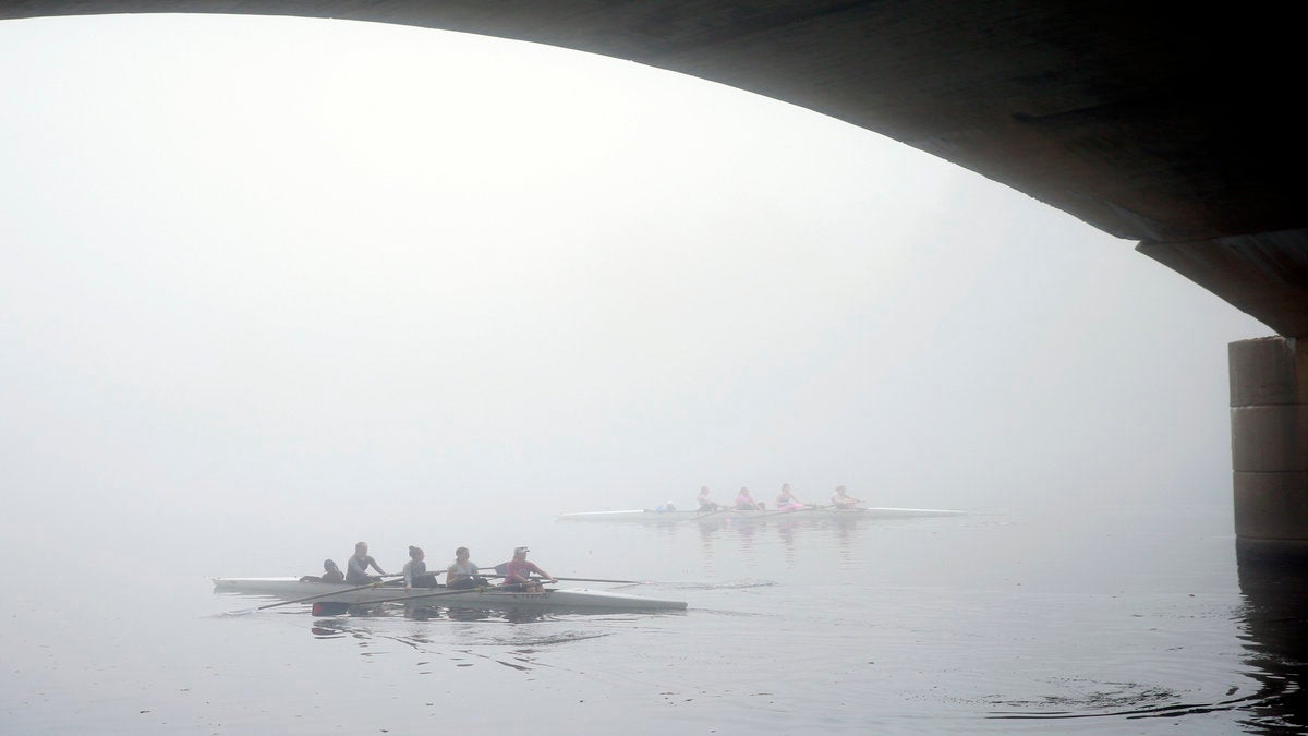  Rowers shrouded in fog move along the Schuylkill River in Philadelphia. (AP Photo/Matt Rourke) 