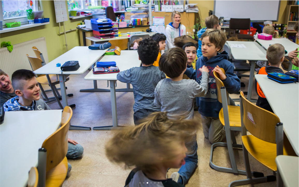 Students do a warm up exercise at Gustav Falke elementary school in the Wedding section of Berlin, Germany. (Jessica Kourkounis/For Keystone Crossroads)