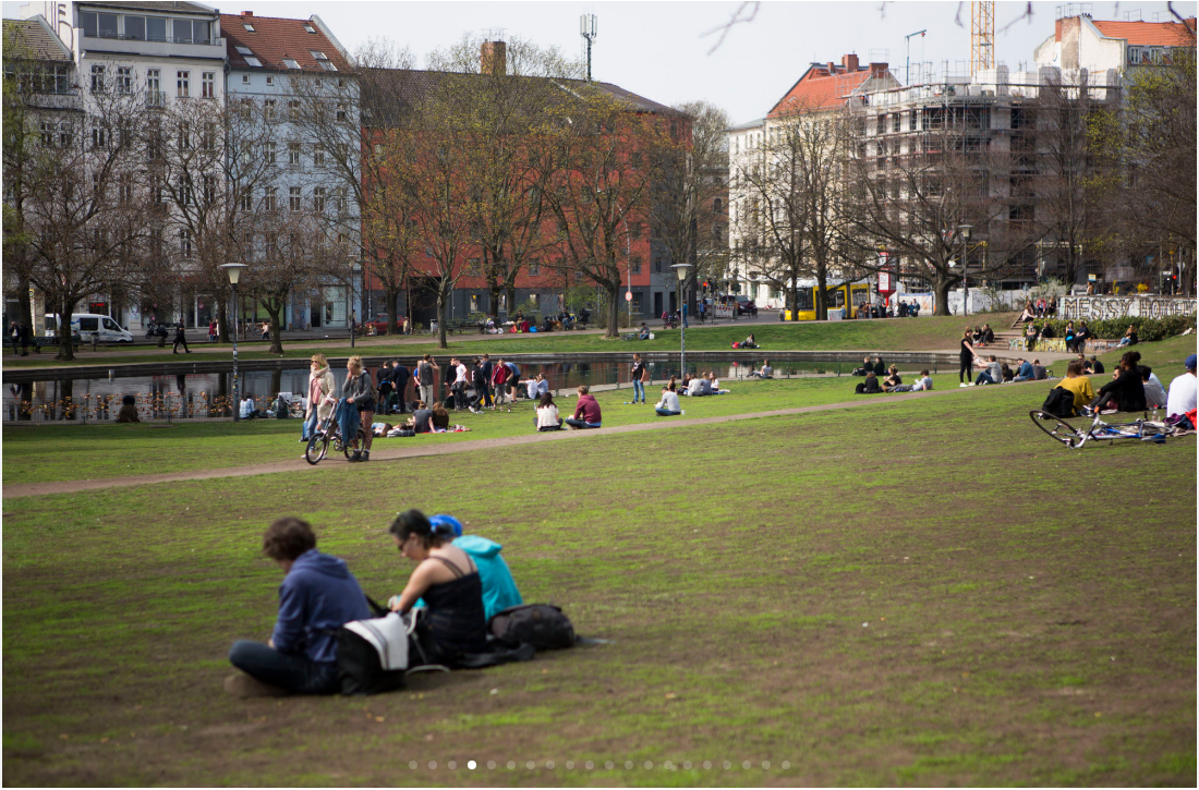 People sit in the grass and stroll through a sprawling park in Old Mitte, a section of Berlin that boomed after German reunification in 1990. (Jessica Kourkounis/For Keystone Crossroads)