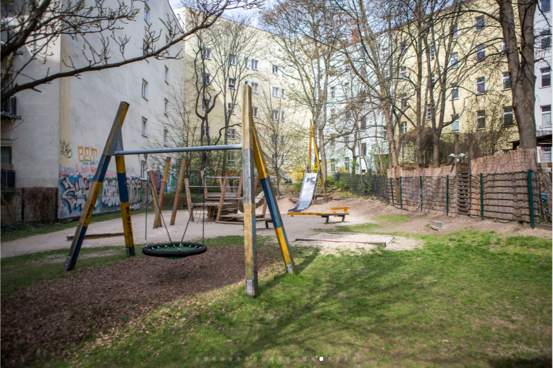 A grassy playground sits in a courtyard of privately owned apartments in Old Mitte. (Jessica Kourkounis for Keystone Crossroads)