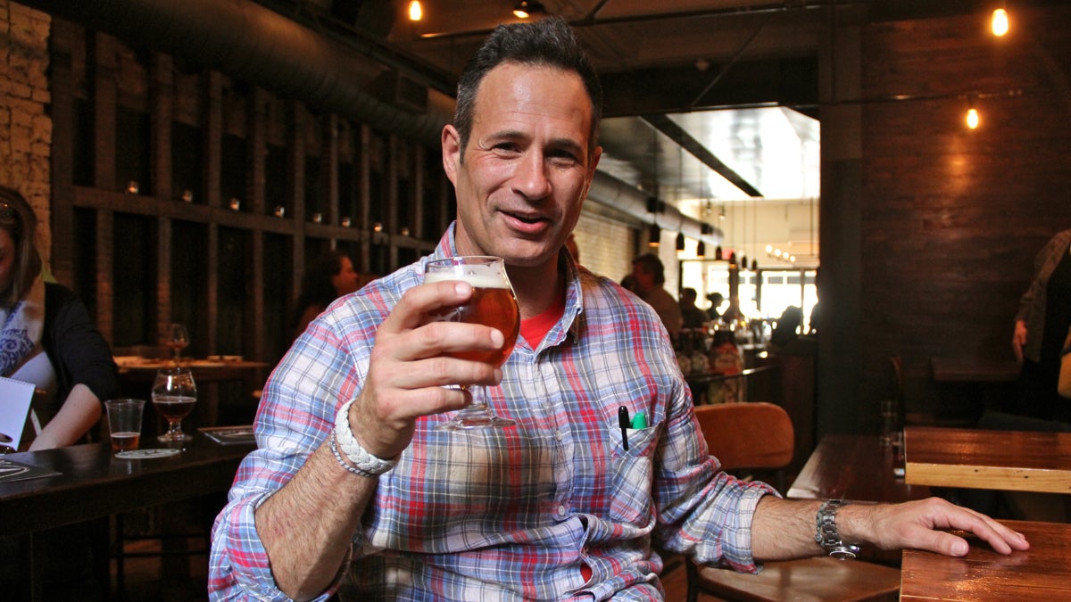  Sam Calagione raises a glass during a book event at Tria Taproom in Rittenhouse Square (Emma Lee/WHYY) 