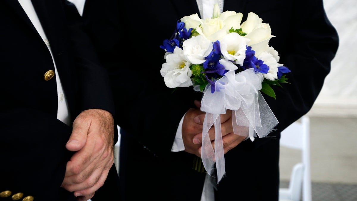  Rick Nelson Flor, right, holds a flower bouquet as he stands next to his partner Robert O'Rourke before their wedding ceremony in West Hollywood, Calif., Monday, July 1, 2013.  (AP Photo/Jae C. Hong, file) 
