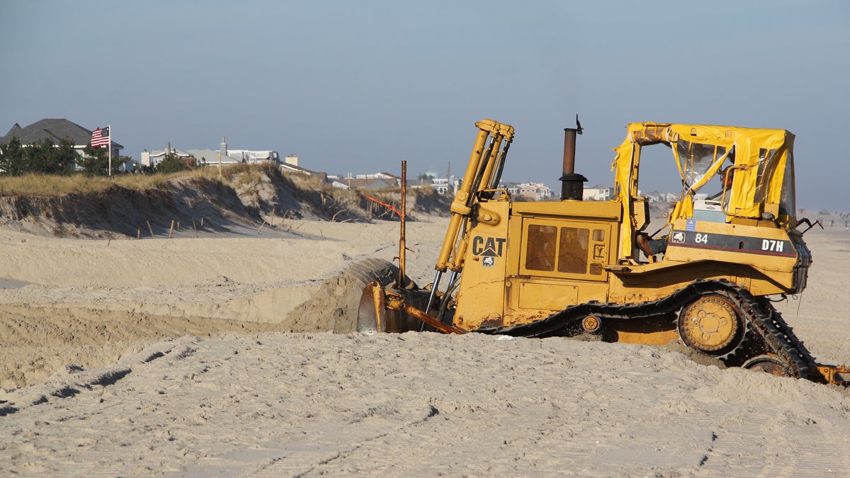  A bulldozer on Long Beach Island moves sand to restore the dunes that were swept away by Hurricane Sandy. (Emma Lee/for NewsWorks) 