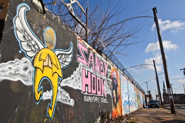 <p>A memorial to the victims of last Friday's tragedy in Newtown, Conn., at Cecil B. Moore and 5th Streets in Philadelphia. (Kimberly Paynter/WHYY)</p>
